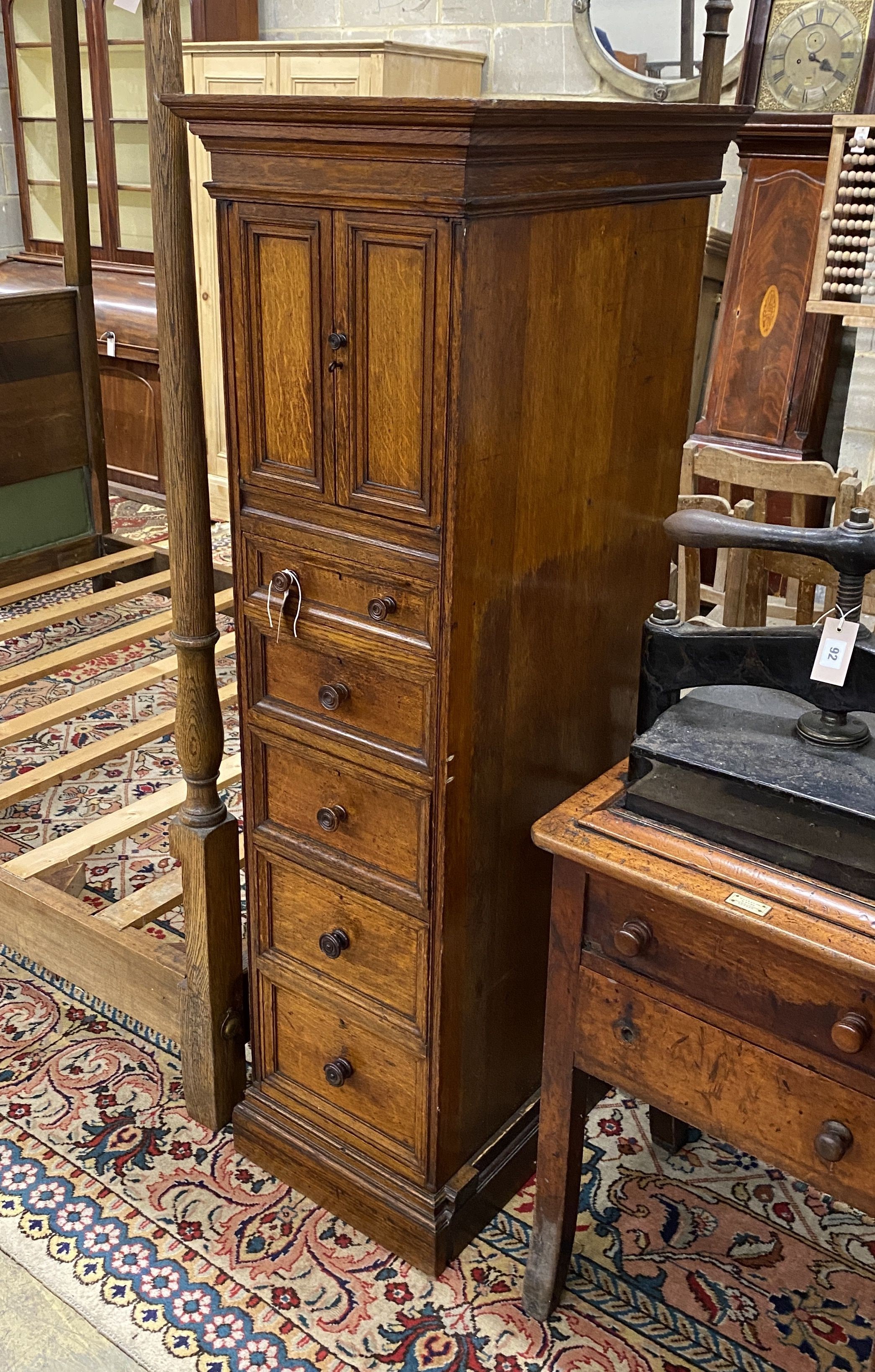 An unusual Victorian oak five drawer cabinet, width 43cm, depth 65cm, height 155cm